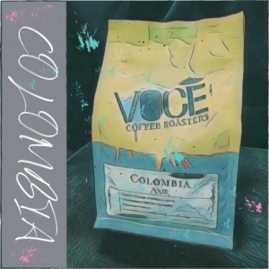 A bag of coffee in a comic drawn style. splatters of Blue, pink and speckles of black paint dot the image. The word "Colombia" written in a scribbled font down the side in a grey background.